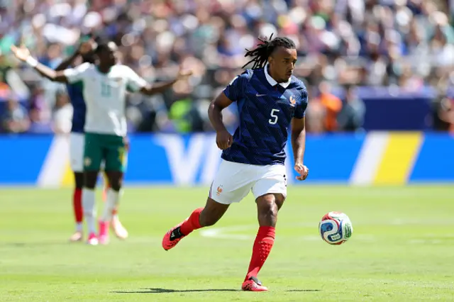 Jules Kounde of France controls the ball