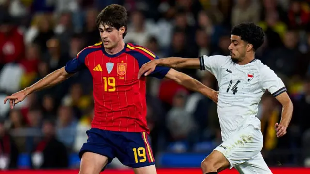 Javi Guerra of Spain battle for the ball with Zidane Iqbal Iraq