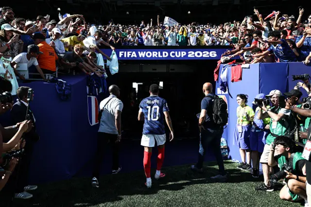 Kylian Mbappe leaves the pitch after winning