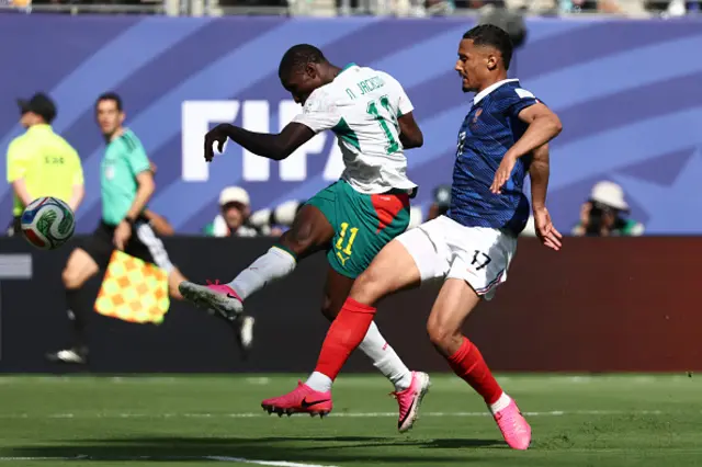 Nicolas Jackson shoots to score a goal later disallowed for offside next to France's defender #17 William Saliba