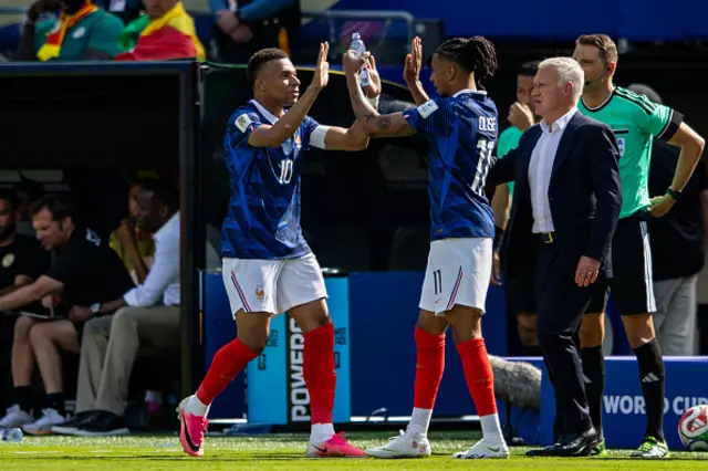Kylian Mbappe (L) of France celebrates with teammate Michael Olise