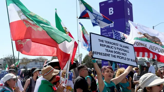Protestors outside SoFi Stadium before World Cup group stage match between Iran and New Zealand on Monday, June 15, 2026 in Inglewood, CA. The served as the official state flag of Iran for centuries until it was strictly banned after the 1979 Islamic Revolution