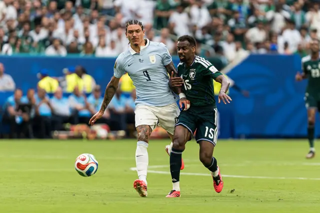 Darwin Nunez of Uruguay battles for position with Abdullah Alkhaibari of Saudi Arabia