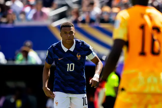Kylian Mbappe of France looks on