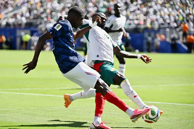 Ousmane Dembele (L) and Senegal's forward #10 Sadio Mane fight for the ball