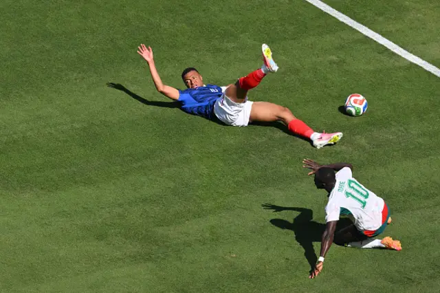 Kylian Mbappe (L) reacts