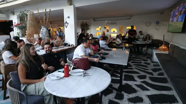 ranians watch the 2026 World Cup football tournament match between Iran and New Zealand at a cafe in Tehran, Iran, on June 16, 2026.