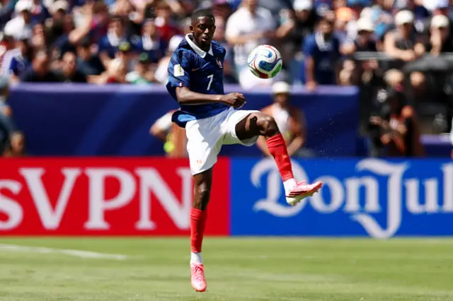 Ousmane Dembele controls the ball
