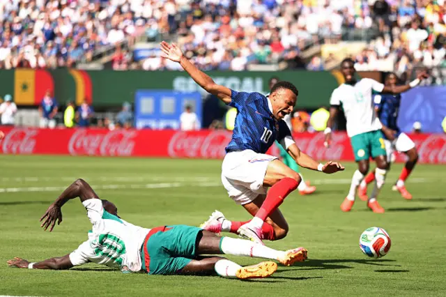 10 Sadio Mane and France's forward #10 Kylian Mbappe fight for the ball