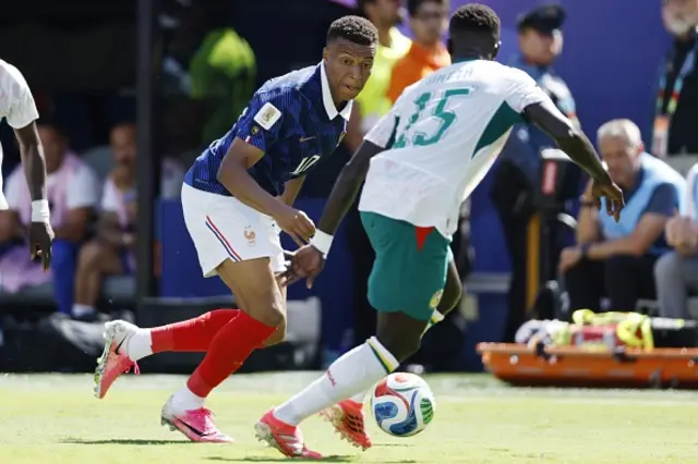 Kylian Mbappe of France, Krépin Diatta of Senegal