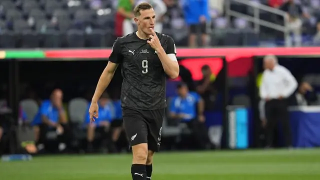 Chris Wood (9) of New Zealand looks on