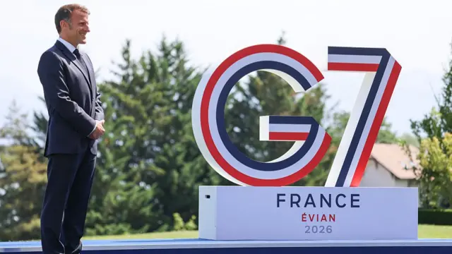 France's President Emmanuel Macron waits for the official greeting ahead of a work lunch as part of the G7 summit.