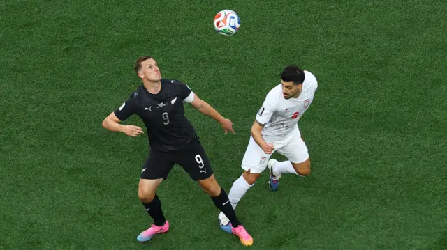 New Zealand's Chris Wood in action with Iran's Saeid Ezatolahi