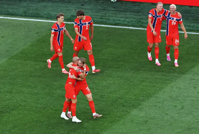Leo Ostigard of Norway celebrates with teammates
