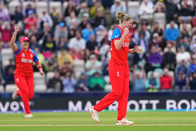 Lauren Bell celebrates taking wicket.