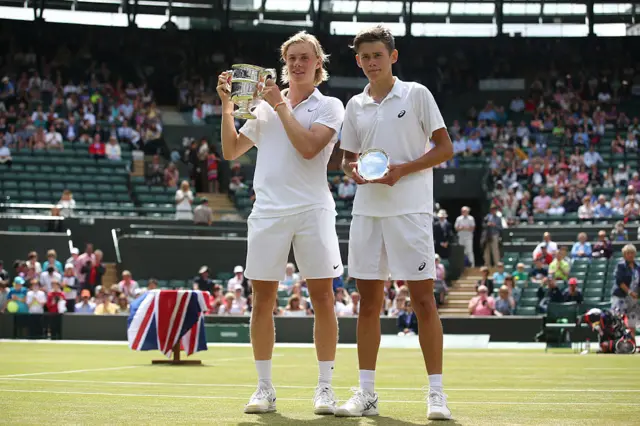Canada's Denis Shapovalov poses with the trophy after beating Australia's Alex de Minaur