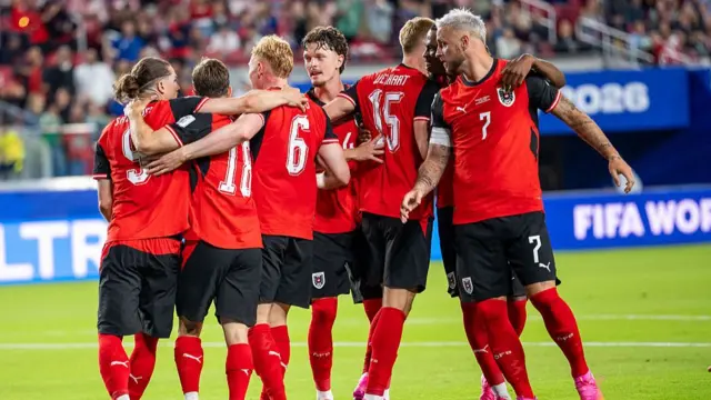 Austria players celebrate scoring