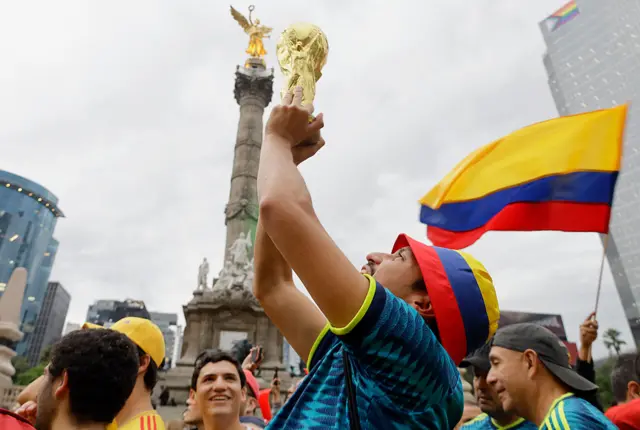 Colombia fan lifting the World Cup