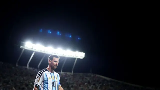 Lionel Messi looks on