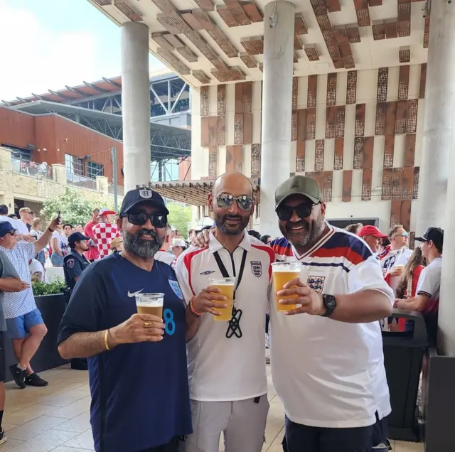England fans pose with pints in Dallas