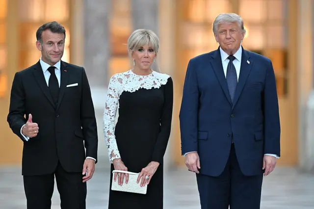 Emmanuel and Brigitte Macron pose with Donald Trump at the Palace of Versailles.