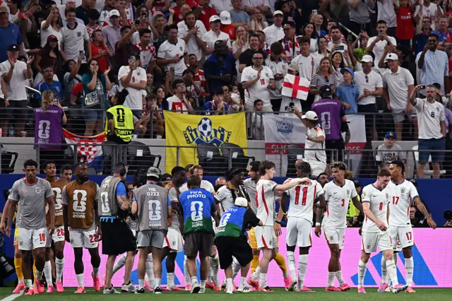 England's forward #11 Marcus Rashford (4th R) celebrates with teammates