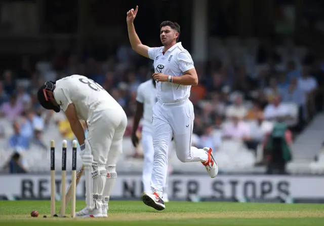 Josh Tounge celebrates bowling out New Zealand batsman Henry Nicholls