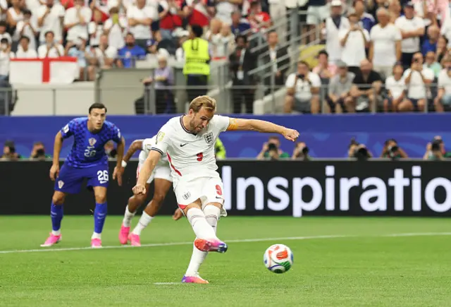 Harry Kane of England takes a penalty