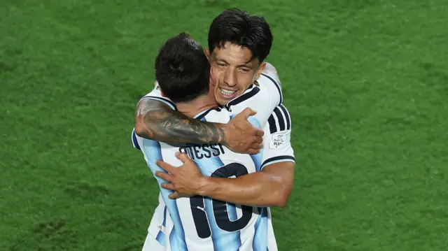 Lionel Messi and Lisandro Martinez hug