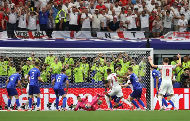 Dominik Livakovic #1 of Croatia makes a save
