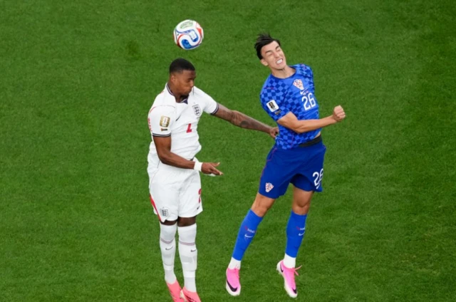England's Ezri Konsa and Croatia's Luka Vuskovic (right) battle for the ball