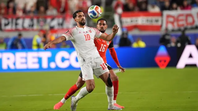 Phillipp Mwene of Austria in action against Musa al-Taamari of Jordan