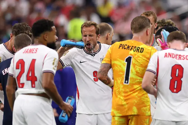 Harry Kane of England takes a drink
