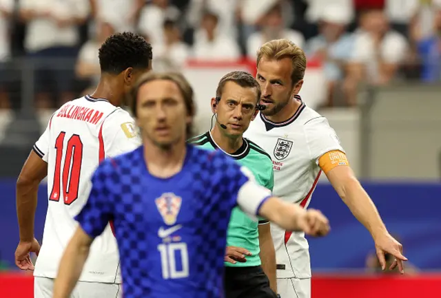 Harry Kane #9 of England argues with referee Clement Turpin