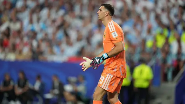 : Emiliano Martinez looks on