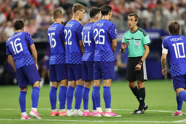 Referee Clement Turpin gives instructions