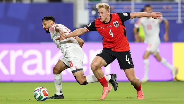 Mousa Altamari of Jordan controls the ball against Xaver Schlager