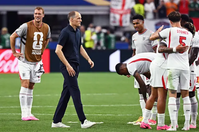 England's German head coach Thomas Tuchel (C) celebrates with teammates