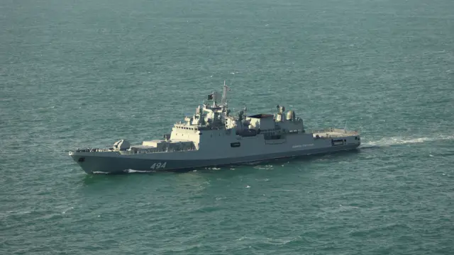 The Admiral Grigorovich, a grey Russian warship sails across the English channel in calm waters
