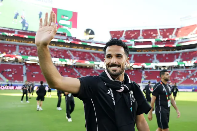 Mahmoud Almardi waving