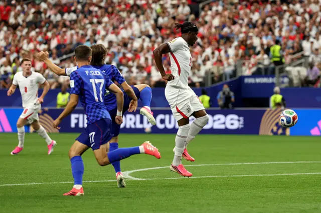 Noni Madueke of England is fouled by Luka Modric