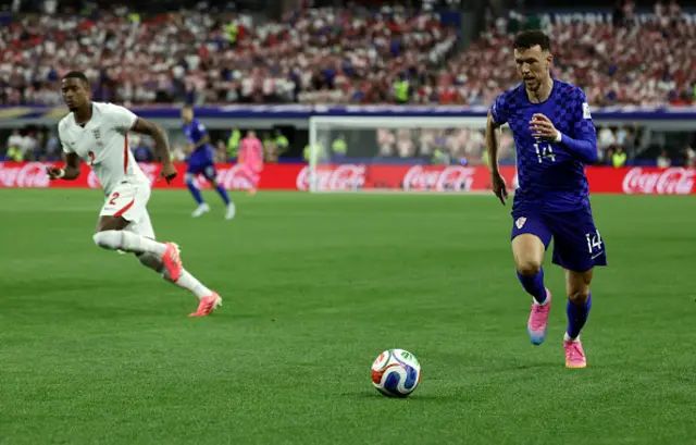 England's defender Ezri Konsa Ngoyo and Croatia's forward Ivan Perisic fight for the ball
