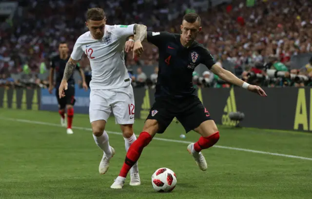 Kieran Trippier and Ivan Perisic wrestle for the ball in the semi-finals of the 2018 World Cup