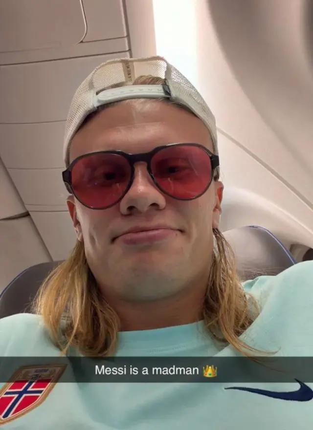 front camera selfie of Erling Haaland with the snapchat caption 'Messi is a madman' with a crown emoji