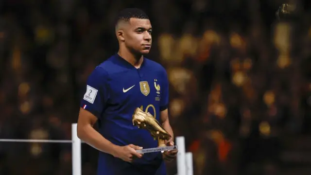 Kylian Mbappe of France with the golden boot after the FIFA World Cup Qatar 2022 final match between Argentina and France at Lusail Stadium on December 18, 2022 in Al Daayen, Qatar.