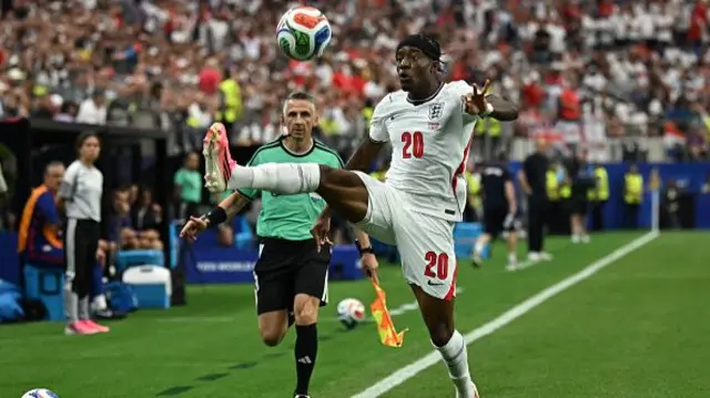 Noni Madueke controls the ball