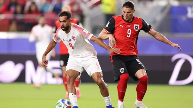 Ali Olwan controls the ball against Marcel Sabitzer