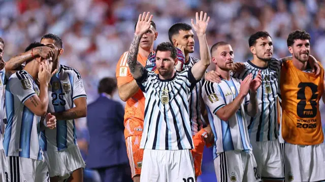 Lionel Messi embraces the Argentina fans