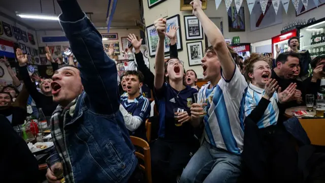 Argentina fans celebrate Lionel Messi's third goal during the FIFA World Cup 2026 Group J match between Argentina and Argelia at "Varela Varelita" Bar on June 16, 2026 in Buenos Aires, Argentina
