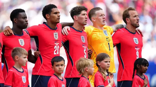 Marc Guehi, Jarell Quansah, John Stones, Jordan Pickford and Harry Kane #9 of England line up on the pitch prior to the international friendly match between England and New Zealand at Raymond James Stadium on June 06, 2026 in Tampa, Florida.